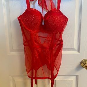 Victoria’s Secret red, lacy, lingerie with garter straps and matching thong